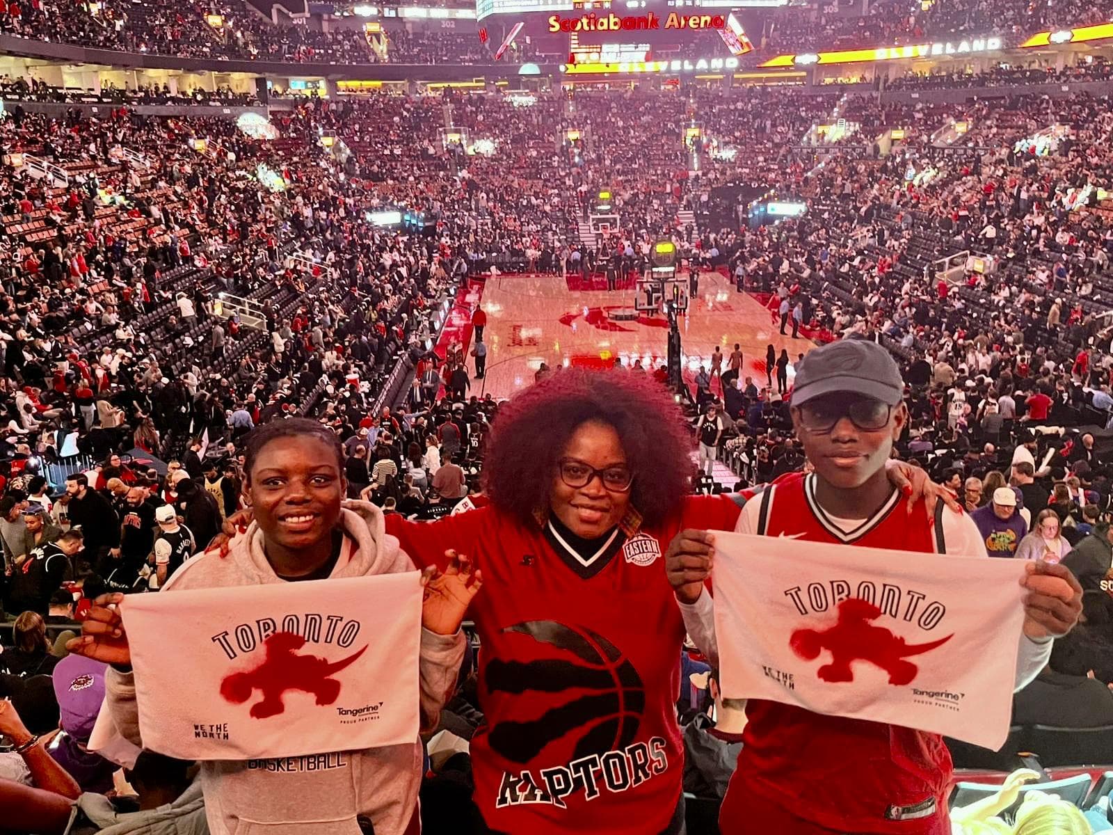 Community members at a Toronto Raptors game